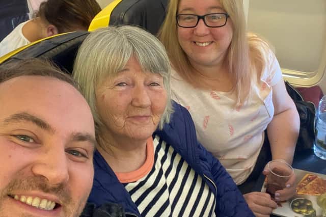 Brad Whiteley pictured with his (L-R) mother-in-law and wife on their Ryanair flight to Fuerteventura. Spain then went into lockdown and the family had their return flight cancelled.