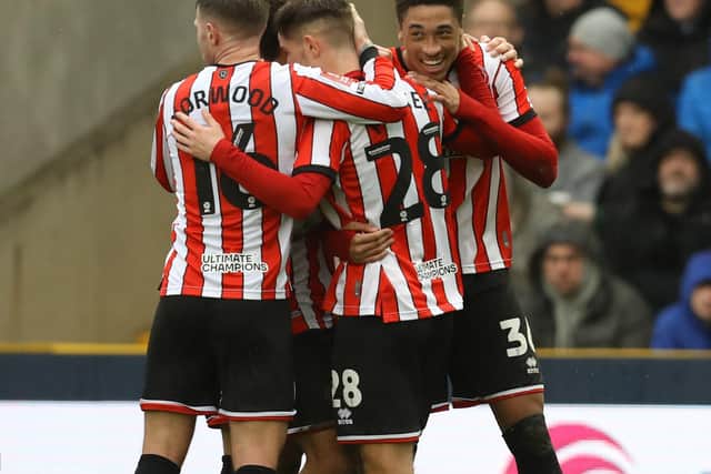 Daniel Jebbison of Sheffield United (r) celebrates scoring at Millwall: Paul Terry / Sportimage