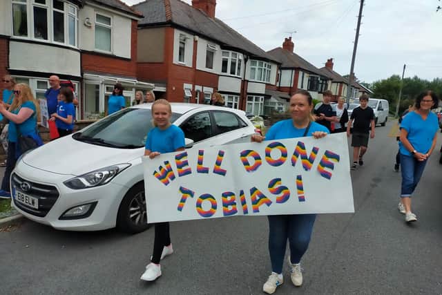 Countless motorists blared their horns in support of Tobias on his trike ride from Strelley Avenue to the park.