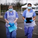 NHS nurses wait for the next patient at a drive through Coronavirus testing site in a car park  (Photo by Christopher Furlong/Getty Images)