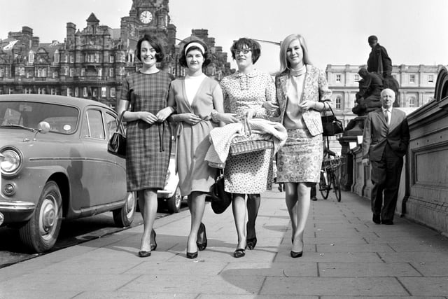 Four women make their way to work on North Bridge in May 1966.