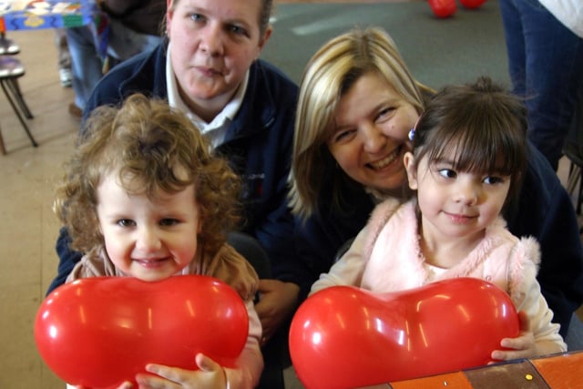 Three-year-olds Niave Crate and Phoebe Crooks with Emma George and Alison Martin from St John's  Playgroup, Ilkeston, at a Valentine's event in the church hall in 2006.
