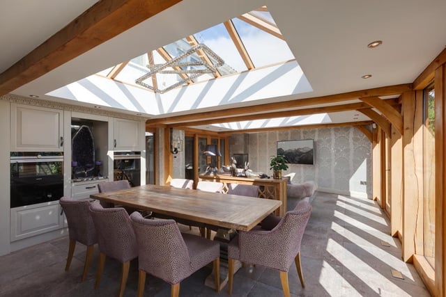 The open plan dining and sitting room is bright and airy thanks to the oak framed roof lantern with double glazed panels.