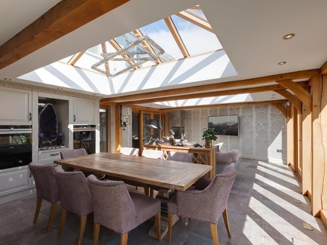 The open plan dining and sitting room is bright and airy thanks to the oak framed roof lantern with double glazed panels.
