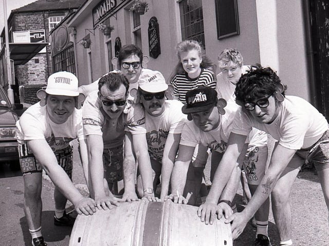 Customers at the Noah's Ark Pub, Crookes, take part in a barrel push as part of the 27 hour Telethon 90 charity extravaganza in May 1990