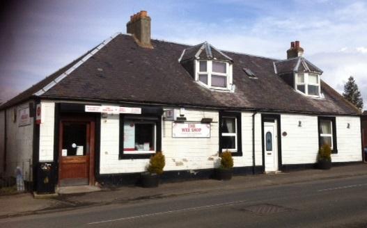 Business premises, formerly a popular store, with owners accommodation to the side, located on the main road through the village - £200,000.