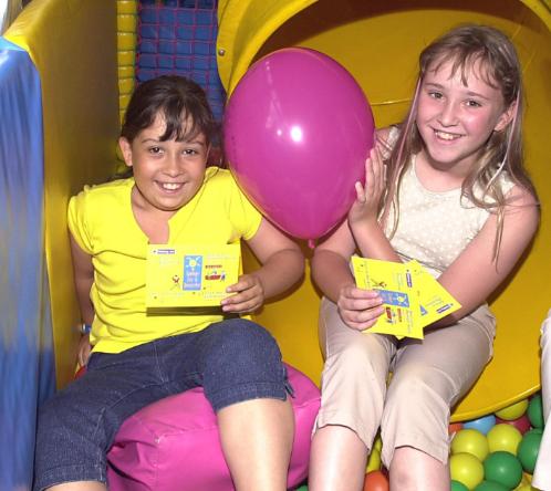 Laura Walker and Charlotte D'Rozario in a fun bus in 2001 as part of the Summer Fun Campaign.