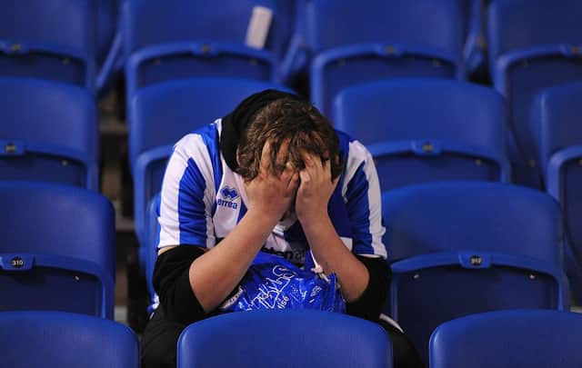 An upset Brighton fan. Photo by Mike Hewitt/Getty Images