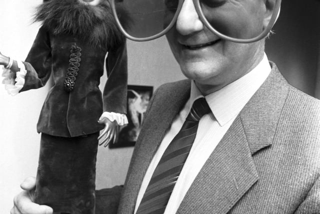 Gerry Anderson, puppeteer and producer of classic shows such as Thunderbirds, Supercar and Stingray, with a Lady Penelope puppet and 'Brains'-type glasses at the City Arts Centre in Edinburgh, March 1986