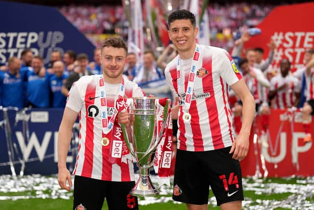 Sunderland's Elliot Embleton and Ross Stewart (right) celebrate with the trophy after the Sky Bet League One play-off final at Wembley Stadium. John Walton/PA Wire.