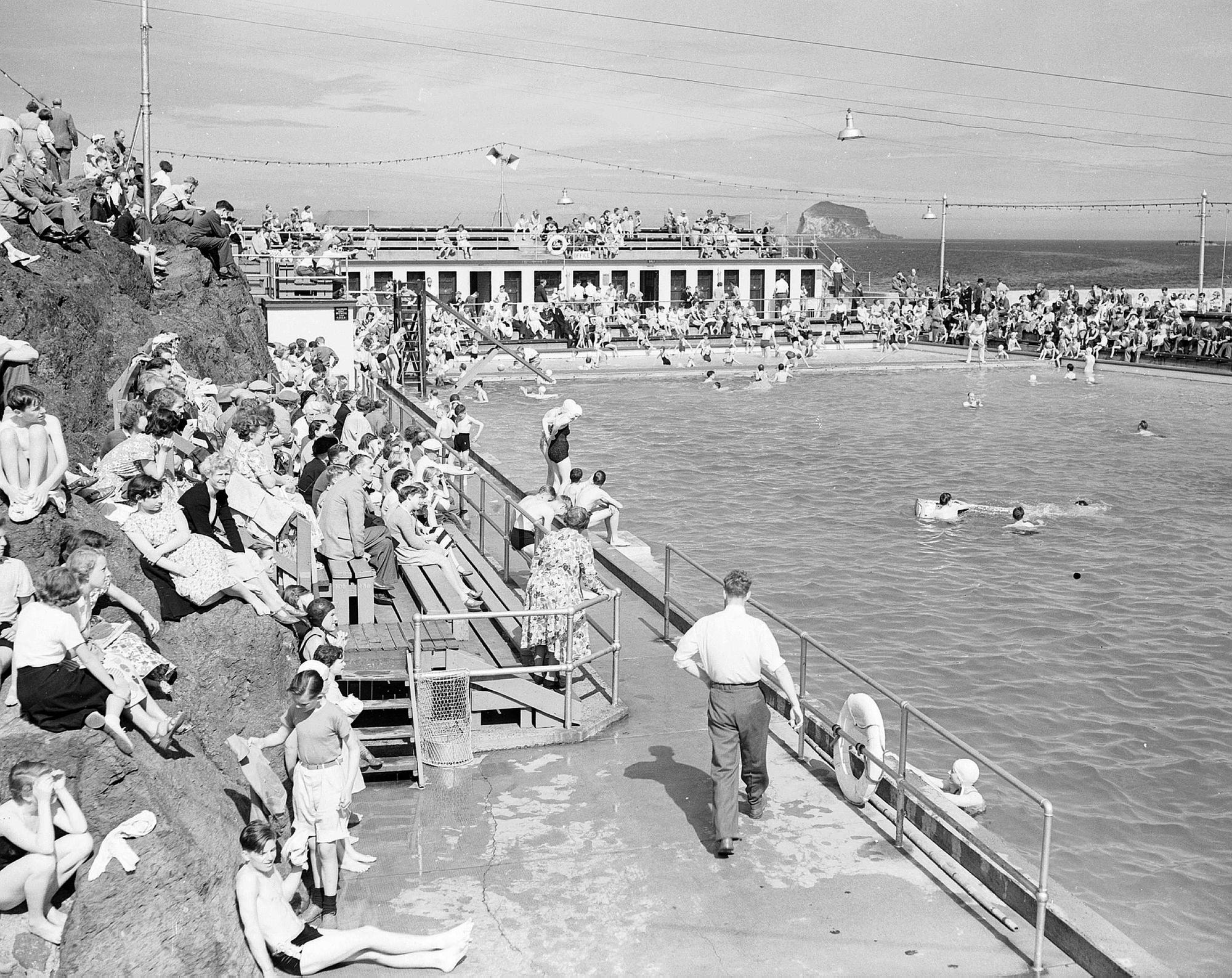 Holidaymakers at North Berwick open-air swimming pool in August 1953.