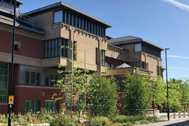 Sheffield Crown Court, pictured, has heard how a former prisoner attacked a guard during her time behind bars and pulled her hair out, bit her finger and punched her in the face.