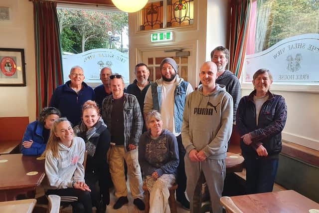 Some of the staff, regulars and decorators who helped to repair the damage at the Sheaf View. Picture courtesy of the Sheaf View
