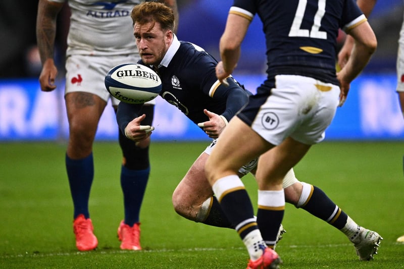 Stuart Hogg passes the ball during the Six Nations rugby union tournament match between France and Scotland on March 26, 2021, at the Stade de France in Saint-Denis, outside Paris (Photo by Anne-Christine Poujoulat/AFP via Getty Images)