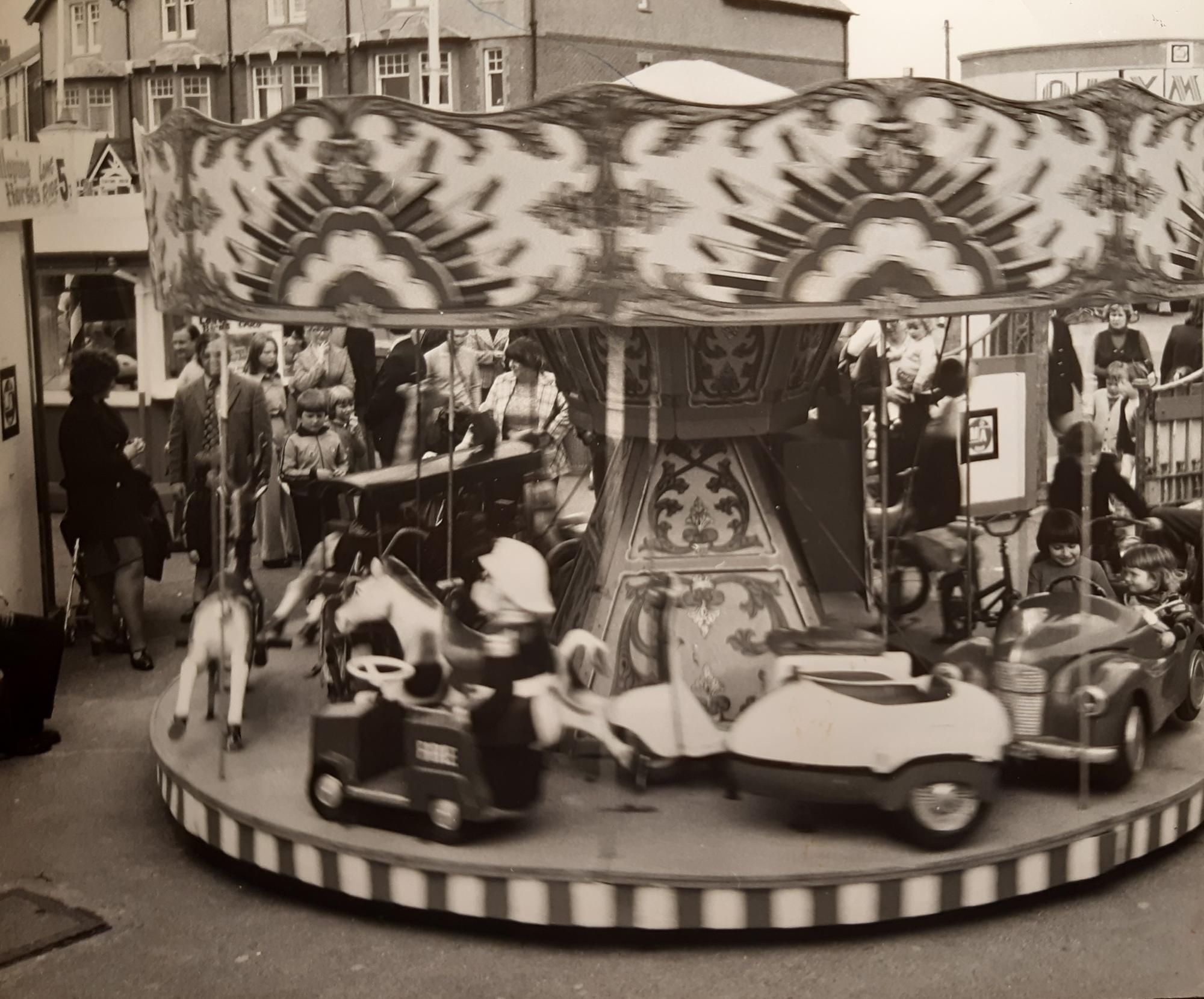 This scene shows the children's fairground opposite Olympia, Kiddies Corner. It is undated but probably mid-1980s