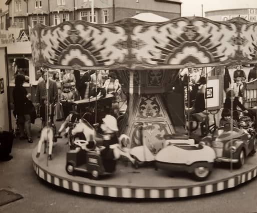 This scene shows the children's fairground opposite Olympia, Kiddies Corner. It is undated but probably mid-1980s