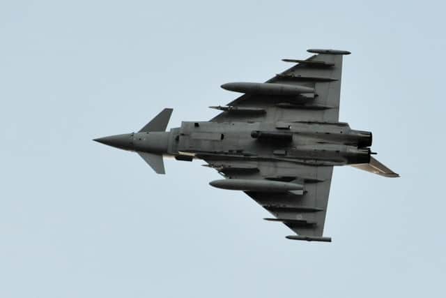 A RAF Eurofighter Typhoon flies over  RAF Akrotiri in Cyprus, as it arrives to bolster the number of jets at the base which began the first British bombing runs over Syria. PRESS ASSOCIATION Photo. Picture date: Thursday December 3, 2015. The air strikes were carried out within hours of a vote by MPs in the Commons to back extending operations against Islamic State (IS) from neighbouring Iraq. Four RAF Tornado jets, which carry a range of munitions including Paveway IV guided bombs and precision-guided Brimstone missiles, took off from the Akrotiri base in Cyprus but defence officials refused to be drawn on the targets of their mission. See PA story POLITICS Syria. Photo credit should read: Nick Ansell/PA Wire 