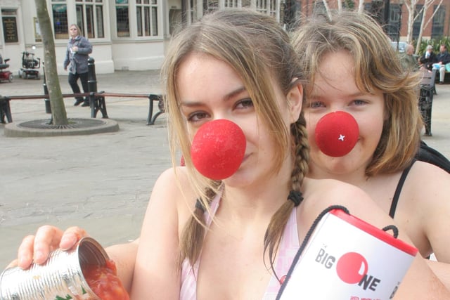 Lady Manners pupils Leyla Allen and Kate Lonsdale raising money for comic relief in their bath of tomatoes and dog food.
