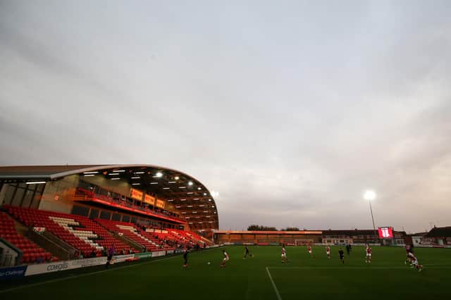 General view of play is seen with an empty stand as matches continue behind closed doors due to Covid-19 regulations during the Carabao Cup Second Round match between Fleetwood Town and Port Vale at Highbury Stadium.