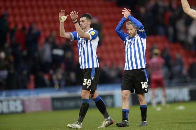 Sheffield Wednesday defender Jordan Storey (left) has enjoyed the challenge of playing for the club.
