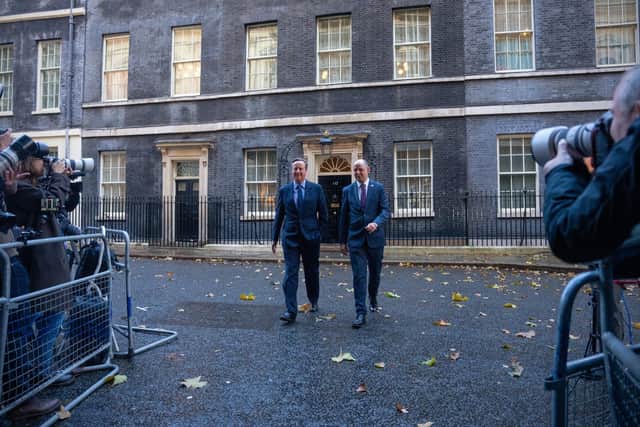 David Cameron leaves 10 Downing Street with Sir Philip Barton, the Permanent Under-Secretary of the Foreign, Commonwealth and Development Office, right after being appointed Foreign Secretary (Picture: Carl Court/Getty Images)