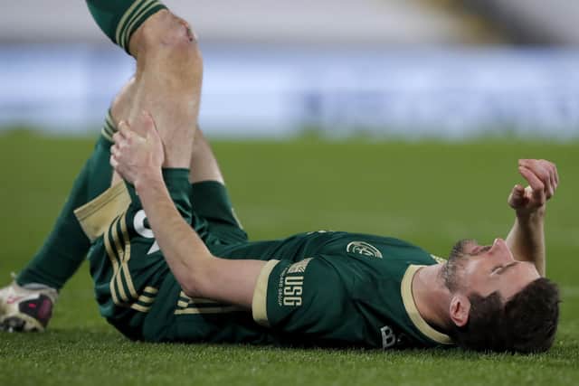Sheffield United's Chris Basham lies injured during the 1-0 defeat at Fulham on Saturday. Photo: Andrew Couldridge/PA Wire.