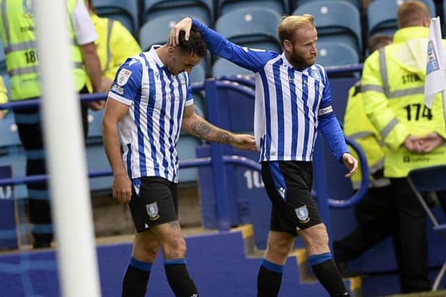 Sheffield Wednesday captain Barry Bannan congratulates Lee Gregory on his goal in their win over Bolton on Saturday.