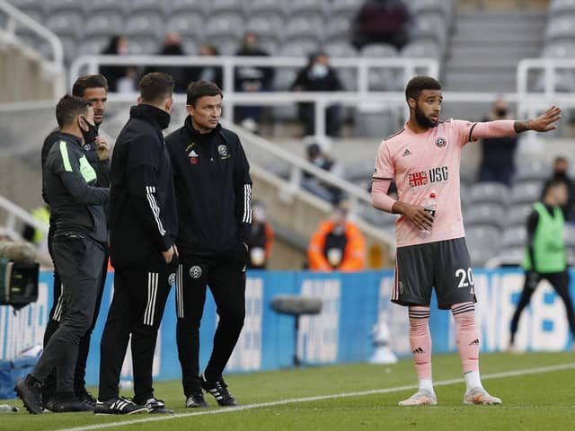 Newcastle, England, 19th May 2021. Jayden Bogle of Sheffield Utd receives instructions from Paul Heckingbottom interim manager of Sheffield Utd during the Premier League match at St. James's Park, Newcastle. Picture credit should read: Darren Staples / Sportimage