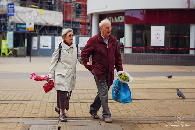 A couple pictured near Sheffield Cathedral after visiting the shops