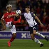 Lyle Taylor of Nottingham Forest controls the ball as Jordan Storey of Preston North End competes for the ball during the Sky Bet Championship match between Nottingham Forest and Preston North End at City Ground on November 06, 2021 in Nottingham, England. (Photo by Ashley Allen/Getty Images)