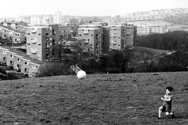 A young boy playing football on Sheffield's Gleadless Valley estate during the 1960s