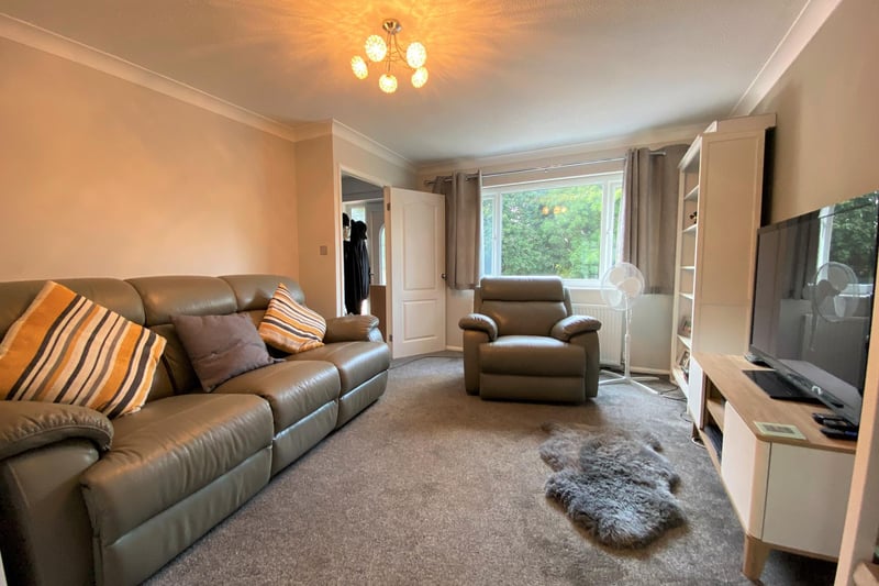 The brochure describes the living room as spacious and it looks like a good place to relax.