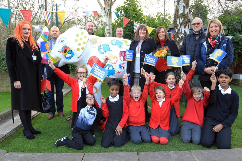Pupils and staff at Porter Croft CE Primary held a special reveal event to unveil 'All as One' elephant from the Herd of Sheffield. Pictured are the family that helped to buy the elephant for the school with pupils and staff.