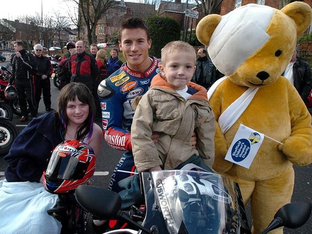 World Super Bike Champion James Toseland pictured outside the Sheffield Children's Hospital with patients, Charlotte Topliss(16) and Steven Straw (5), on March 25, 2005