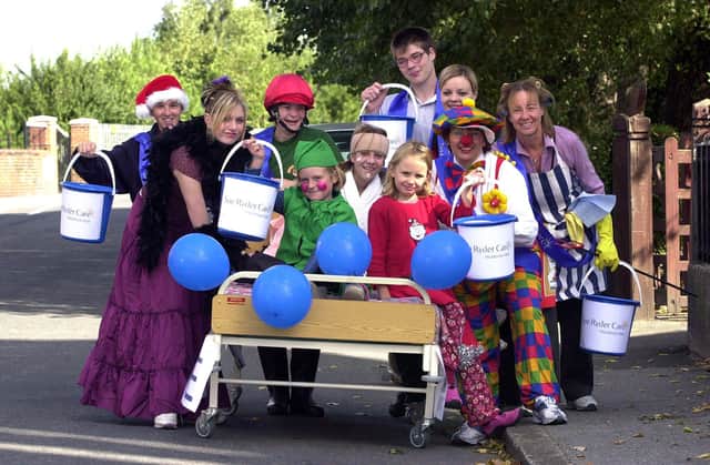 Which Docaster care home staff can you spot in these retro pictures? This snap shows the 2003 Bed pushers, the Millennium Volunteers and helpers,  who set off from Goldthorpe on their sponsored bed push to raise money for Sue Ryder Care at Hickleton Hall. On the bed are, from left, Emily White, aged eight, Emily Notman, aged 13, and Lucy Turner, aged seven. Pushing are, from left, John Twiggs, aged 22, Sarah Dixon, aged 18, Sarah Bradley, aged 25, Peter Kidd, aged 17, Amy Wright, aged 25, acting care centre manager Wendy Eliot (c), aged 45. and Millenium Volunteers co-ordinator Diane Cadman, aged 50.