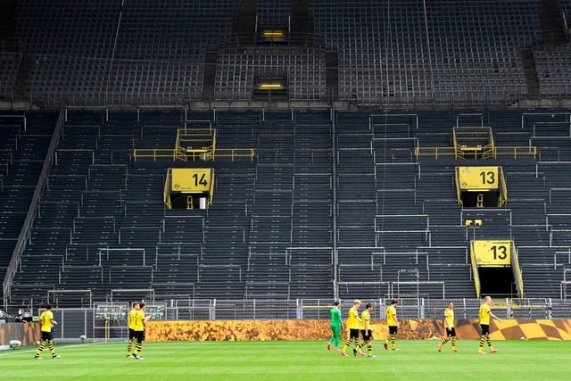 Dortmund would usually be roared onto the pitch by 81,000 supporters - but their clash against Schalke was near-silent.
