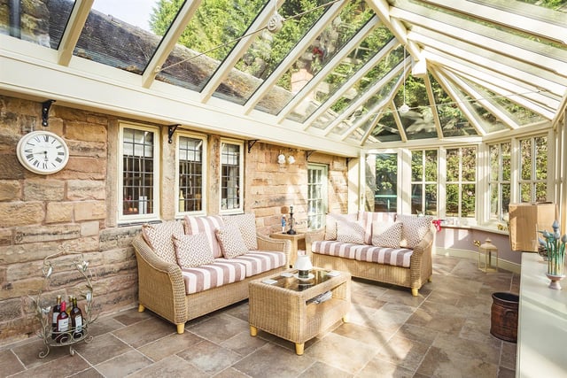 Constructed in hardwood with a Victorian style glass roof, tiled floor (under-floor heating) and French style doors opening onto patio and gardens.