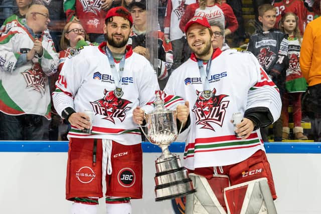 Brandin McNally, left, with the trophy. Picture: James Assinder/Cardiff Devils