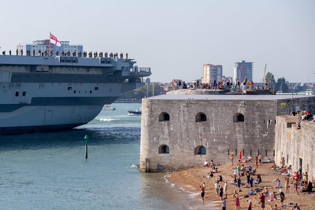 Crowds watch on from the Hot Walls in Old Portsmouth as HMS Queen Elizabeth departs on Monday afternoon. Picture: Habibur Rahman
