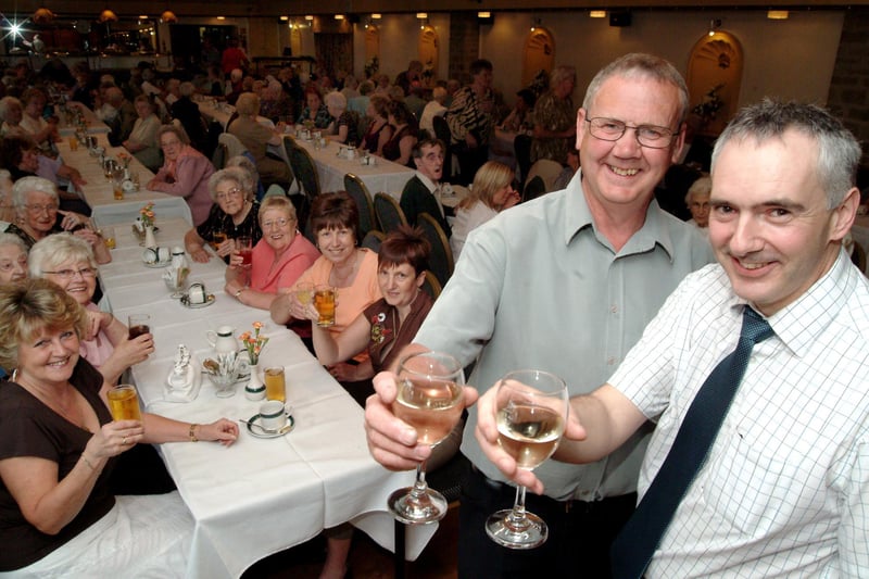 Steve Lunn President of Warsop Rotary and Stuart Parsons raise a glass at the senior citizens party held at the hostess in 2006