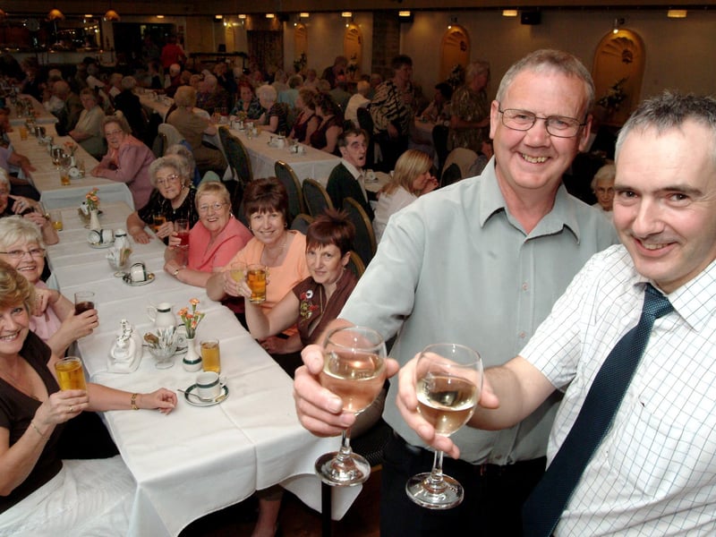 Steve Lunn President of Warsop Rotary and Stuart Parsons raise a glass at the senior citizens party held at the hostess in 2006