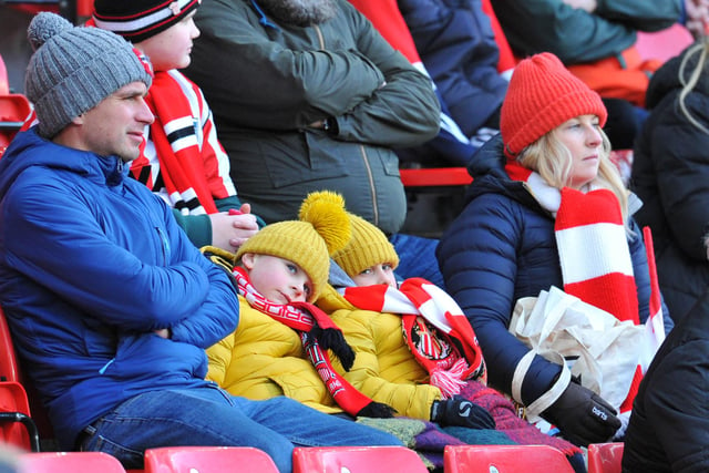 Two young Sunderland fans watch on at the Stadium of Light.