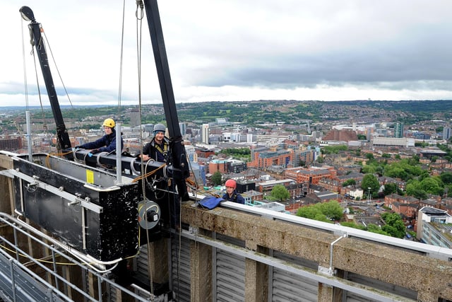 Our photographer Andrew Roe got an insight into the view from the Arts Tower roof when he photographed people preparing to abseil down and clean the windows. Picture: Andrew Roe