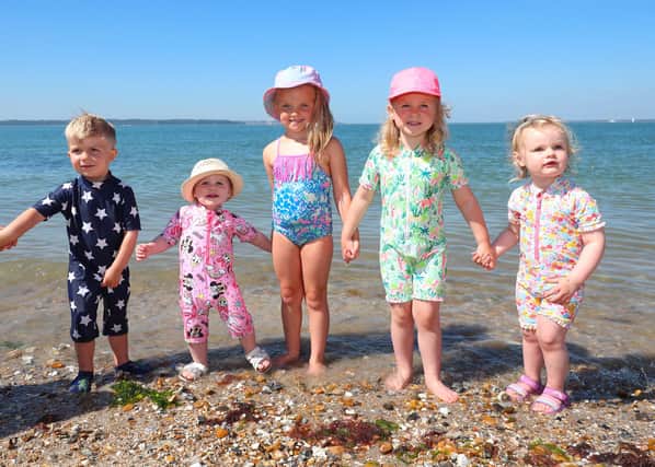 A group of children enjoying the sunshine in Lee-on-the-Solent. (l-r) Freddy Huntley, Florence Sanders, Olive Keil, Jean Simmonds and Pearl Sanders cool off in the water. Picture: Stuart Martin (220421-7042)