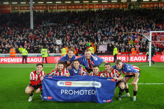 Sheffield United players celebrate their promotion to the Premier League with the fans: Simon Bellis / Sportimage