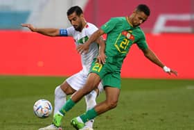 Iran's defender Ehsan Hajisafi (L) and Senegal's midfielder Iliman Ndiaye vie for the ball (JAKUB SUKUP/AFP via Getty Images)