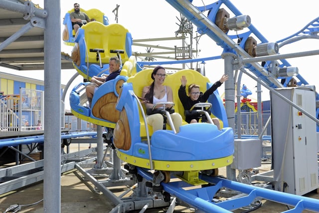 A family enjoys one of the roller coasters at Clarence Pier. Picture Ian Hargreaves (180720-6)
