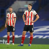 Sander Berge (R) and Chris Basham are not receiving the benefit of trying to play the game the right way, Sheffield United manager Chris Wilder has admitted David Klein/Sportimage