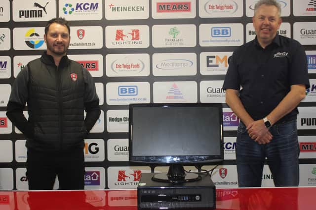 Jamie Noble of Rotherham United Community Sports gets a PC for his job club from Rich Davies at Affinity IT Services Ltd
