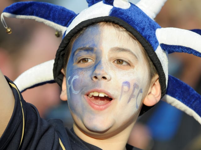 A young fans celebrates the victory
